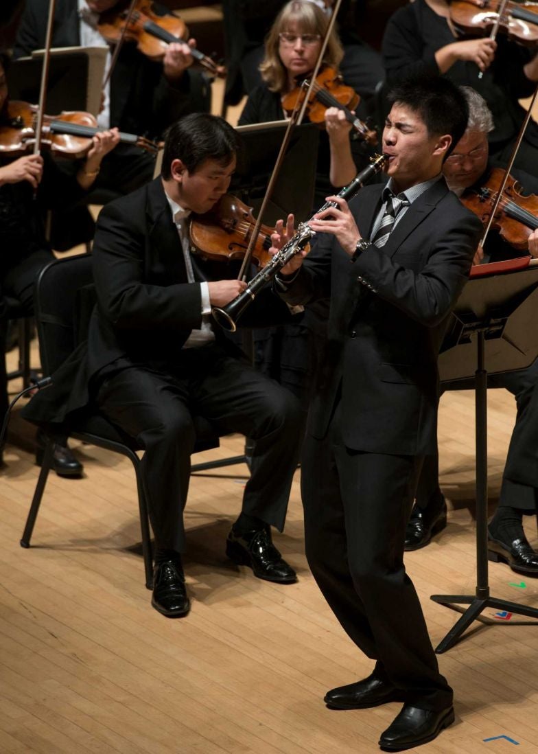 Lin Ma on stage with clarinet